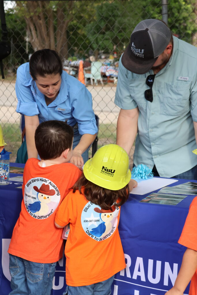 NBU speaking to kids during a conservation event