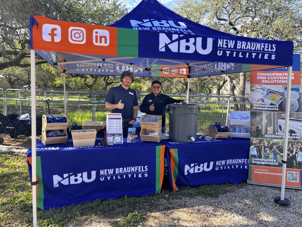 NBU employees set up behind a booth ready t talk about conservation