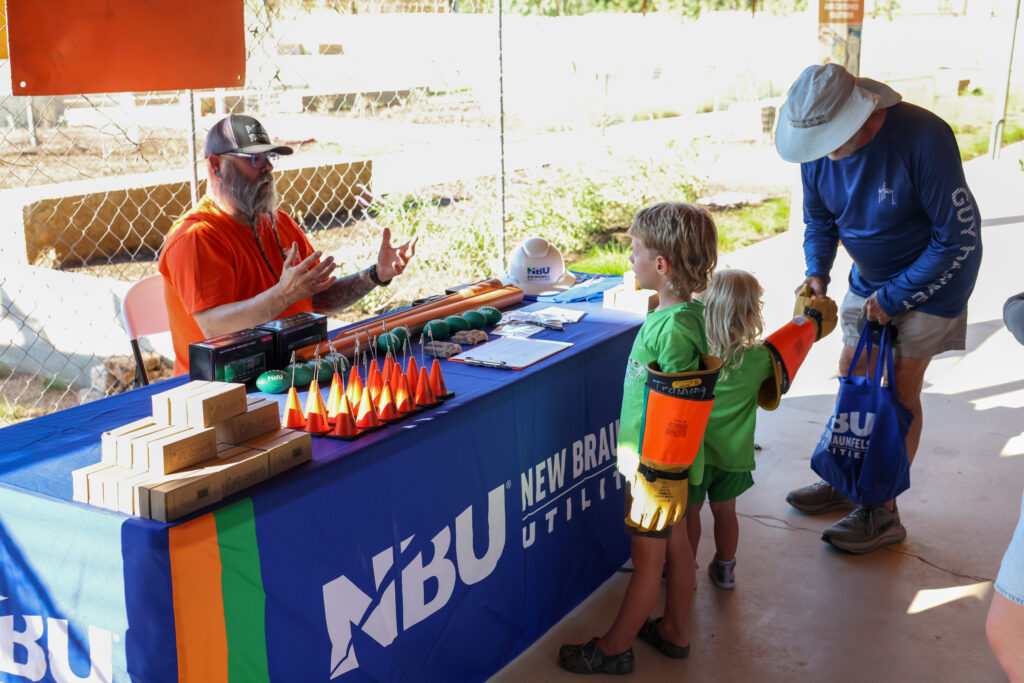 NBU safety team member talks with families about safety